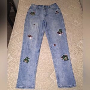 HT Denim Mom Jean in a size 7. It features Pixies, mushrooms, and ladybugs